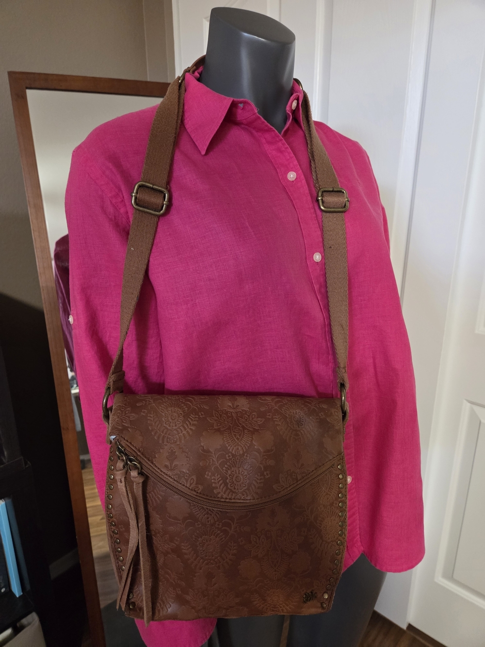 the SAK tan Floral Embossed Crossbody Bag